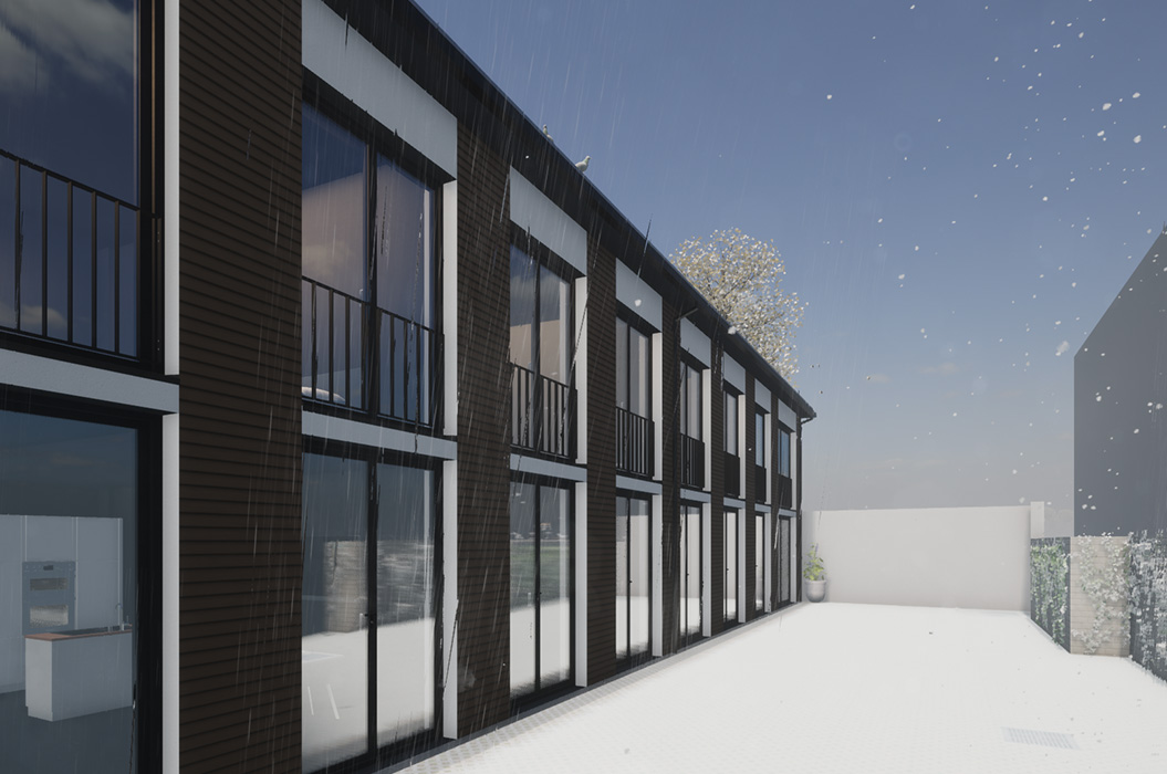 Moderne schwarze Wohnanlage mit Balkonen im Schnee und klarem Himmel